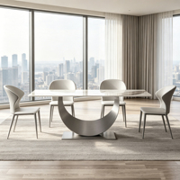 Table à manger rectangulaire minimaliste italienne en pierre frittée avec base incurvée en acier inoxydable brossé, mobilier de maison robuste
