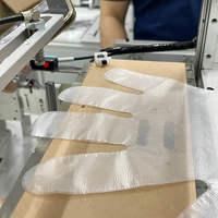 Industrie de la fabrication de machines de haute technologie Pliage de gants jetables en plastique PE et machine à emballer les gants, contrôle PLC