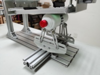 Machine de sérigraphie cylindrique manuelle réglable pour bouteilles et stylos