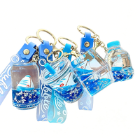 En gros, Pendentif porte-clés bateau à voile bleu à paillettes liquides, rempli d'huile, pour sac à dos, clés de voiture, cadeau