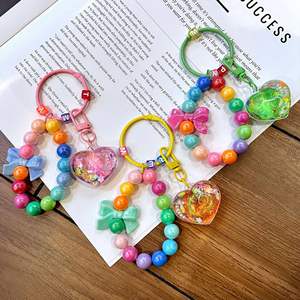 Porte-clés personnalisé avec perles et paillettes liquides, cœur et nœud arc-en-ciel, sangle de téléphone Kawaii pour filles, cadeau d'anniversaire pour adolescentes, vente en gros - Product Image 6
