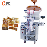 Machine d'emballage de remplissage automatique verticale de sachets de film bâtonnets d'étanchéité pour jus de miel liquide sauce au lait