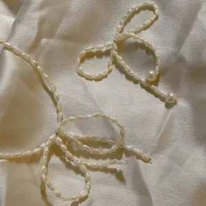 Hochwertige Gold-PERLE-Halskette romantische Schleifenknotenform modische Kette für Damen weibliche hochwertige modische Schmuck-Halsketten