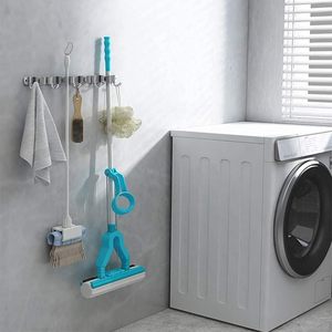 Support mural moderne gris en acier inoxydable SUS304 sans perçage pour balais et serpillères, avec crochets multiples non pliables et rangement en silicone - Product Image 1