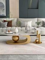Combinaison de table basse ovale avec panneau en pierre artificielle
