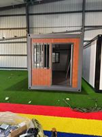 Maison préfabriquée en conteneur pliable en acier 20 pieds paquet plat modulaire installation rapide pour immeuble de bureaux et hôtel
