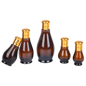 Droplet Shape Hair Oil Glass Bottle Brown Glass Essential Oil Bottle Amber Empty Glass Bottles With Aluminium Gold Cap