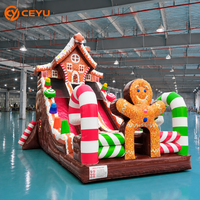 Toboggan gonflable Ceyu Maison en pain d'épices avec doubles toboggans rouges, arche en forme de canne à sucre, décorations en forme de bonbons, base en chocolat, pour le plaisir des fêtes en extérieur