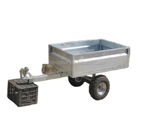 small ATV towed behind utility garden trailer