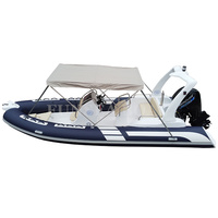Bateau pneumatique rigide à coque en fibre de verre de 5,8 m (19 pieds) de couleur bleue, avec tente pour la pêche