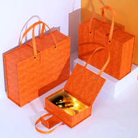 Boîte de rangement magnétique carrée de luxe orange recyclable avec logo personnalisé Doublure en carton ondulé avec éponge pour parfum