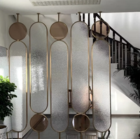 Paravent en métal moderne de luxe rotatif avec design découpé au laser pour salon