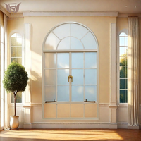 Ventanas abatibles estilo granja francesa DEMEA con marco de aluminio negro y rejas de seguridad para villa rural