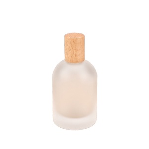 Flacone Spray per profumo in vetro smerigliato rotondo da 100ml con coperchio in bambù - Product Image 1