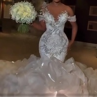 Robes de mariée sirène de luxe 2024 à volants, col transparent, cristaux argentés perlés, volants à étages, robes de mariée queue de poisson grande taille