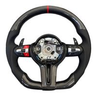 Volant en fibre de carbone pour BMW, disponible pour une personnalisation haut de gamme. Parfait pour votre propre véhicule ou comme cadeau haut de gamme.