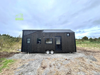 Petite maison alternative au logement traditionnel-Structure de conteneur en acier et en bois avec un design moderne pour une utilisation dans une villa et un appartement