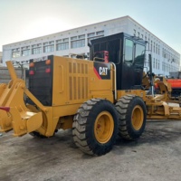 Niveleuse Caterpillar 140H d'occasion, équipement de construction, machine routière robuste jaune