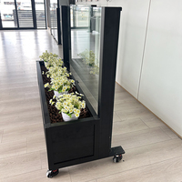Balustrade en verre rétractable avec jardinières et roulettes, cloison mobile réglable en hauteur pour la décoration de restaurants commerciaux