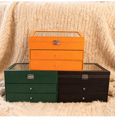 Caja expositora de gafas de cuero PU naranja, negro y verde con 24 ranuras y 2 cajones, nueva, al por mayor