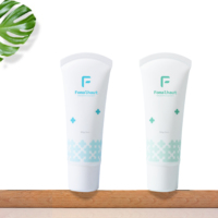 Tube de crème pour le corps en plastique avec tête de massage