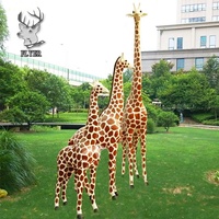 Statue de girafe en fibre de verre décorative de grande taille pour parc d'attractions en plein air à vendre