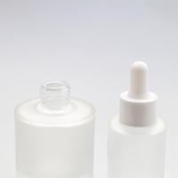Bouteilles compte-gouttes plates en verre transparent dépoli, vides, de luxe, pour soins de la peau, huiles capillaires et huiles essentielles, 1oz 30ml 50ml, avec conception de couleur de logo personnalisée