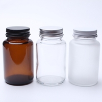 Vente en gros Bouteille en verre dépoli 75ml 100ml 150ml 200ml Bouteille en verre sodocalcique transparente dépolie pour tablette/pilule avec couvercle en métal