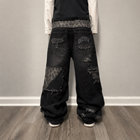 DiZNEW Jeans vintage noirs amples à jambes larges, effet usé, patchwork, avec empiècements imprimés léopard, coupe empilée, pour hommes, OEM ODM personnalisé