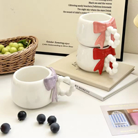 Mug à café, thé, lait ou eau en céramique mignon de style INS avec un nœud 3D sur la poignée en forme de perle