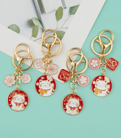Vente en gros de breloques en fleurs de cerisier japonaises, chat mignon, couple créatif, accessoires de sac, porte-clés en métal pour cadeau