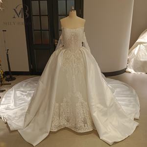 فستان زفاف ميلي برايدل MQW02253 بتصميم ملكي منتفخ مع ذيل منفصل وأكمام منفصلة ورباط وتطريز كامل باللؤلؤ على الطراز الدبي - Product Image 1