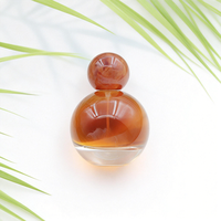 Vente en gros d'usine 30 50 80ml Flacons de parfum de luxe en verre cosmétique Flacons vides sphériques transparents avec bouchon à bille