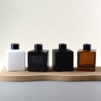 Diffuseur en verre personnalisé de 50 ml et 100 ml Bouteilles Diffuseur vide d'huile Aroma Rotin Stick Diffuseur avec bouchon à vis Emballage en carton