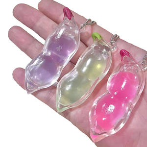 Nouveau jouet anti-stress en silicone transparent en forme de pois, pendentif porte-clés pour enfants de 5 à 7 ans - Product Image 1