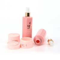 Ensemble de flacons pulvérisateurs à pompe Conteneur de crème de soin de la peau Bocaux Emballage en plastique pour animaux de compagnie Emballage cosmétique rose cylindrique de luxe 100ml 200ml