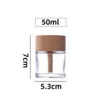 Vente en gros de 50ml de désodorisant clair pour voiture bouteille vide roseau rond diffuseur de voiture bouteille en verre