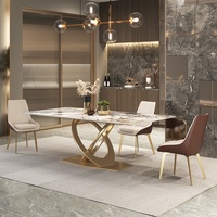 Table à manger moderne en pierre frittée postmoderne de luxe en acier inoxydable grand petit appartement villa modèle chambre salon en métal