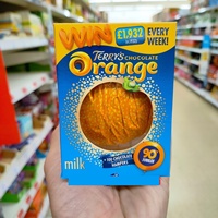 Meest verkochte sinaasappel-melk met zwarte bloemblaadjes en witte fruitachtige snoepchocolade-coating, geschikt voor bijeenkomsten