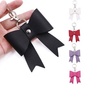 Llavero de cuero sintético con lazo YY, accesorios para mujer y niña, dije de lazo rosa y negro para bolso, llavero de cuero con lazo para cartera - Product Image 1