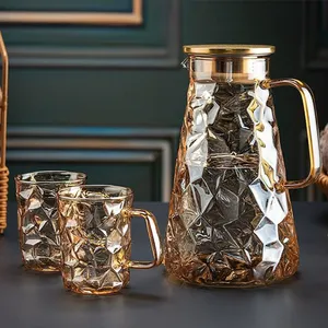 Venta caliente elegante diseño de diamante jarra de agua con mango juegos de tetera de vidrio con tapa de acero inoxidable para bebidas de hielo