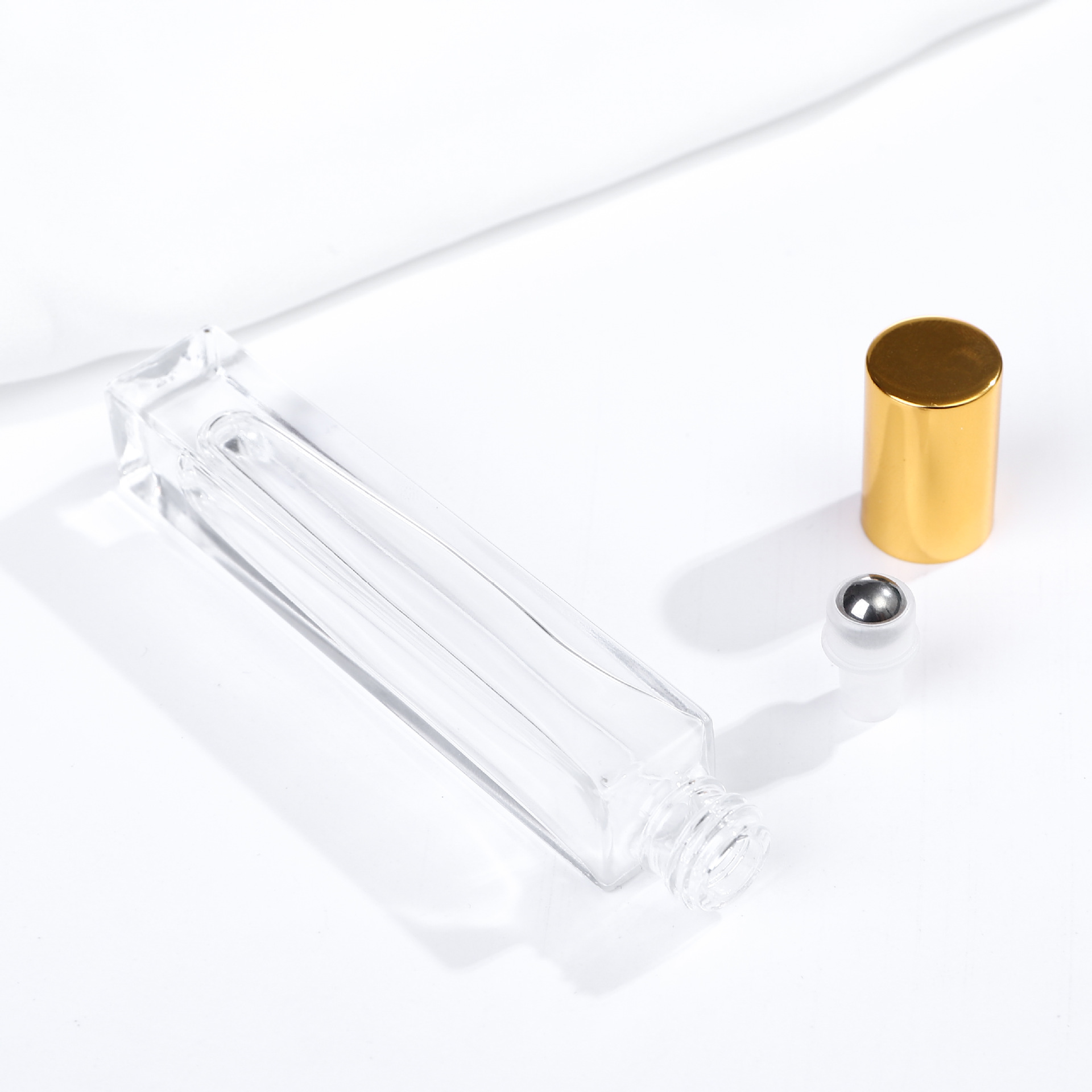 Square silver ball-shaped bottle