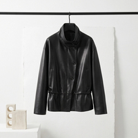Veste en cuir de mouton noir vintage pour femme, col montant, boutons asymétriques, véritable peau de mouton, avec poches zippées