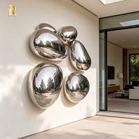 Sculpture murale en acier inoxydable poli miroir RELONG en forme de galet à vendre