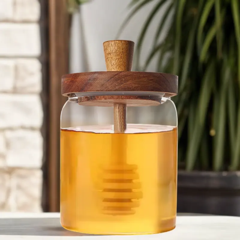Pots de miel en verre borosilicaté rond transparent de qualité alimentaire avec couvercle en bois pour le stockage du miel