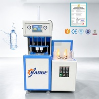 Machine de soufflage de bouteilles PET semi-automatique à deux cavités, économique, capable de fabriquer des bouteilles d'eau minérale, des bouteilles de boissons, des bouteilles de jus