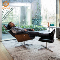 Fauteuil de bureau inclinable de luxe au design italien moderne avec appui-tête et repose-pieds, pivotant à 360°, idéal pour la salle de sport