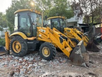 Chargeuse-pelleteuse JCB3CX d'occasion avec composants essentiels (moteur, pompe, boîte de vitesses) à prix compétitif
