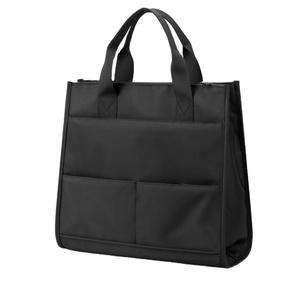 Sac fourre-tout personnalisé noir avec compartiment pour ordinateur portable en toile de coton imperméable - Product Image 1
