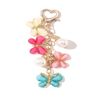 Breloque de sac de bijoux faite à la main pour femme, cadeau pour amie, porte-clés animal mignon, porte-clés coloré floral, grand papillon, perle